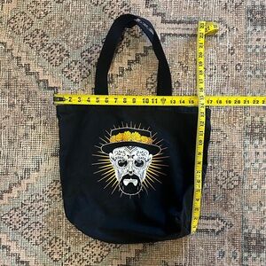 Elegant Black Tote with Artistic Skull Design
